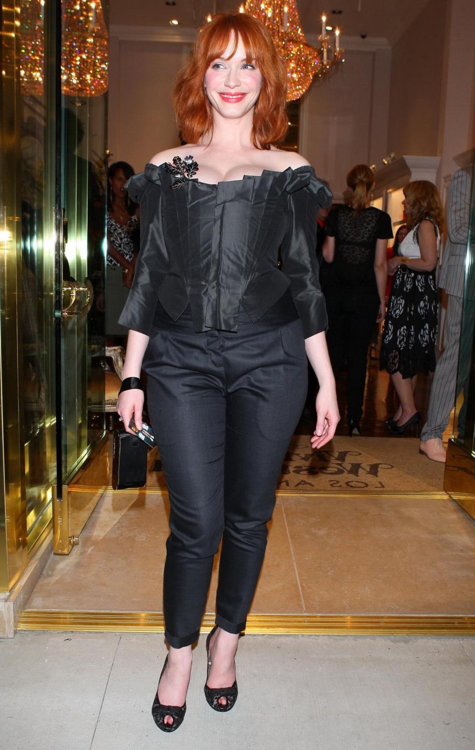 16P Christina Hendricks showing huge cleavage at Vivienne Westwood LA store opening