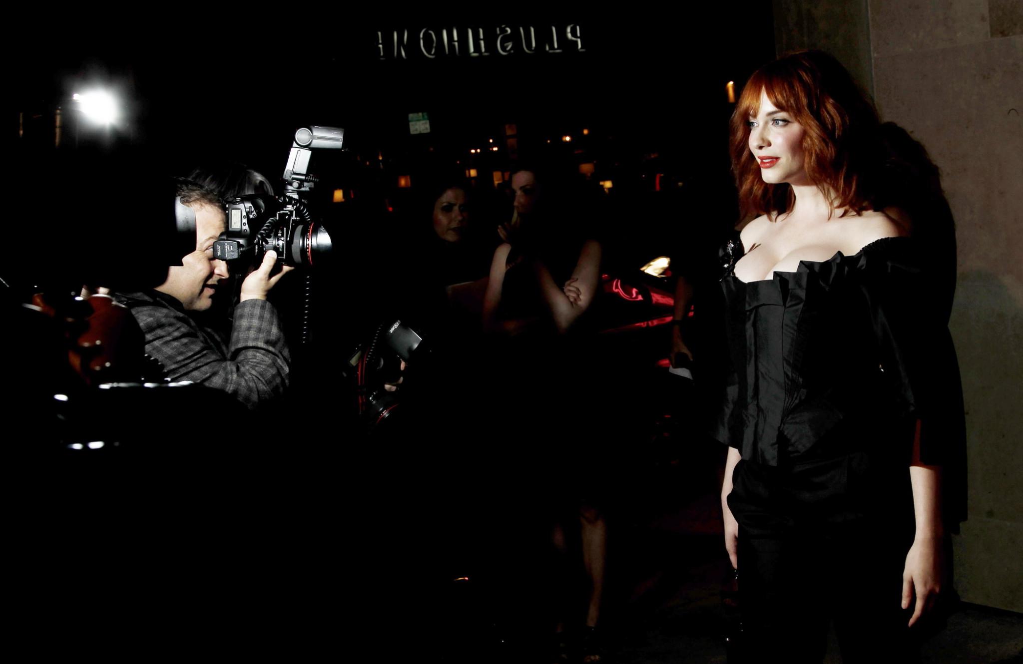 16P Christina Hendricks showing huge cleavage at Vivienne Westwood LA store opening