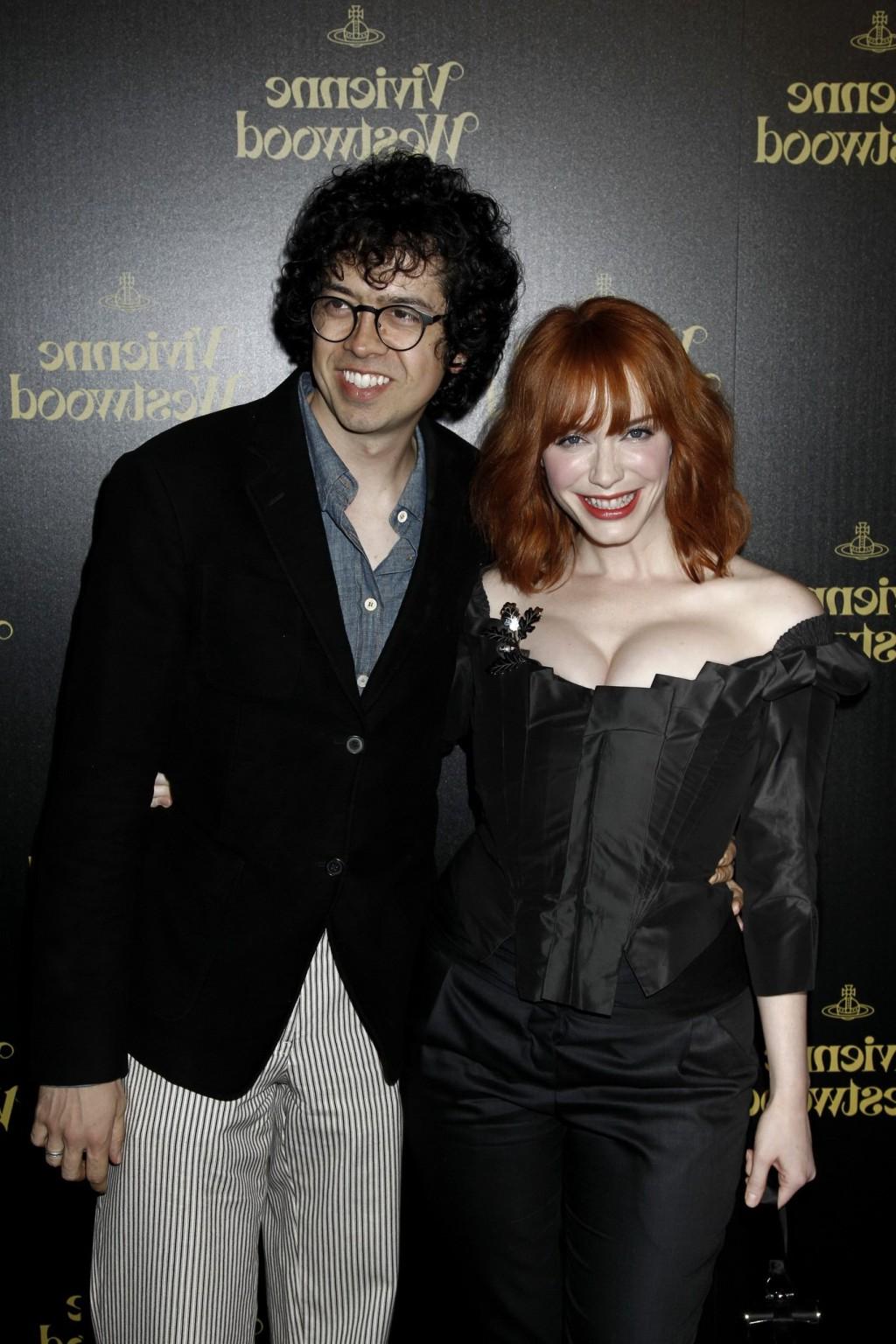 16P Christina Hendricks showing huge cleavage at Vivienne Westwood LA store opening