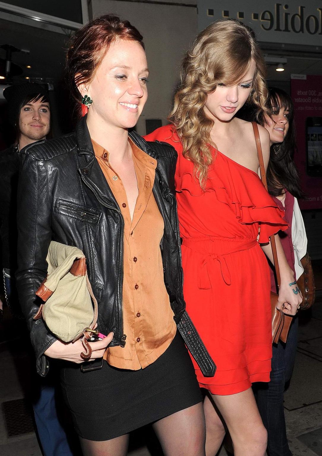 14P Taylor Swift leggy in red mini dress leaving Benihana Restaurant in London