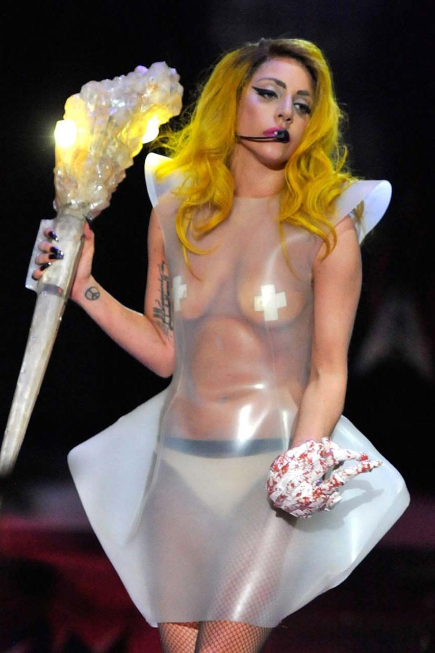 16P Lady Gaga exposing her tits in see thru dress on stage paparazzi pictures