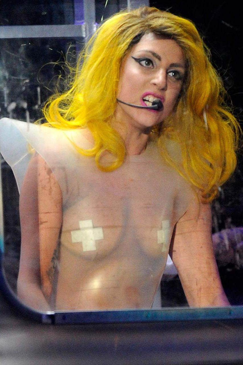 16P Lady Gaga exposing her tits in see thru dress on stage paparazzi pictures