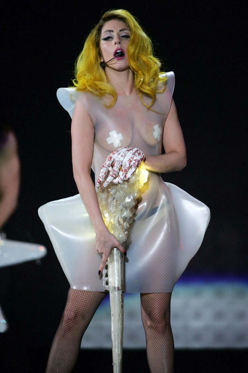 16P Lady Gaga exposing her tits in see thru dress on stage paparazzi pictures