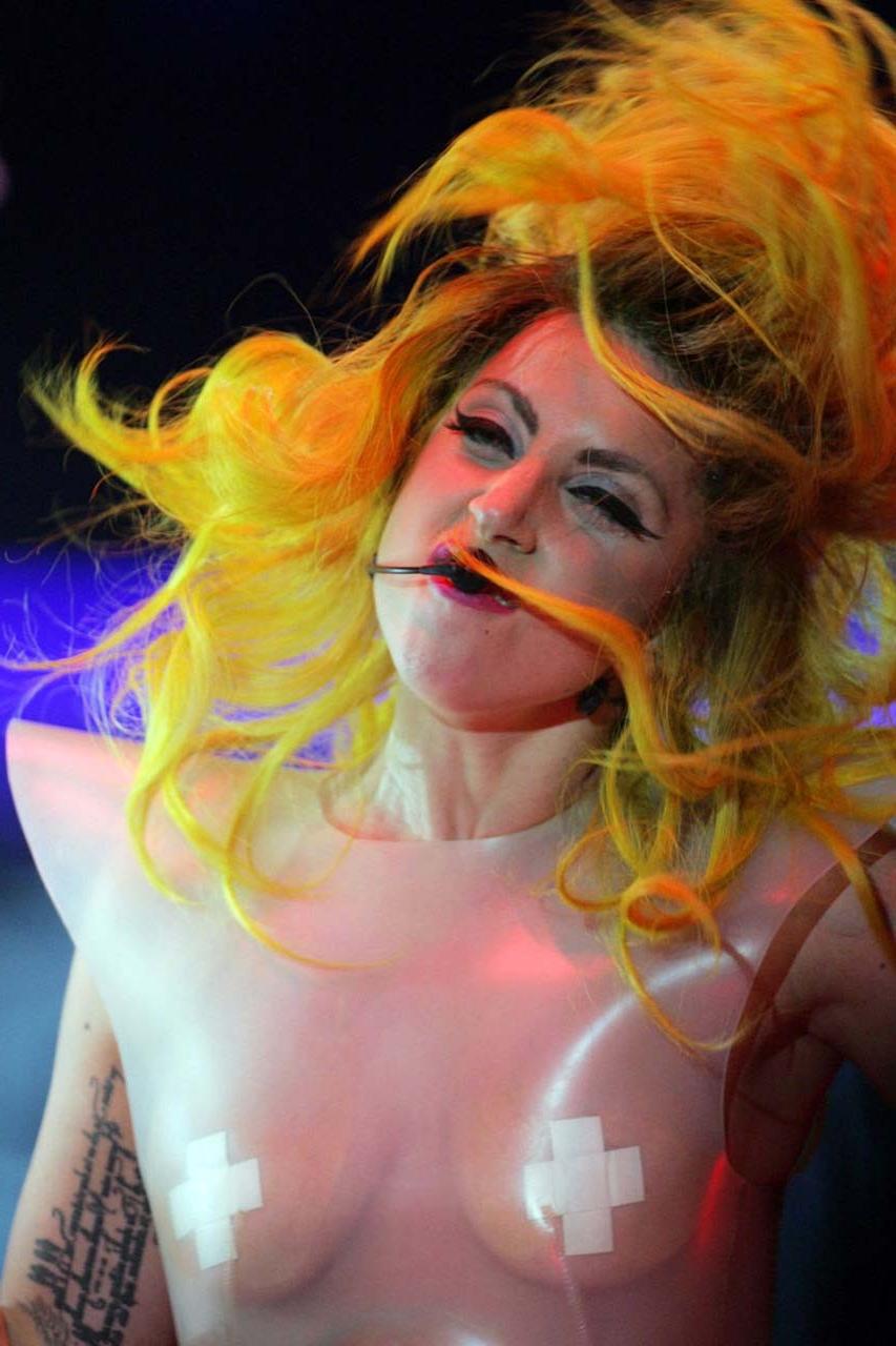16P Lady Gaga exposing her tits in see thru dress on stage paparazzi pictures
