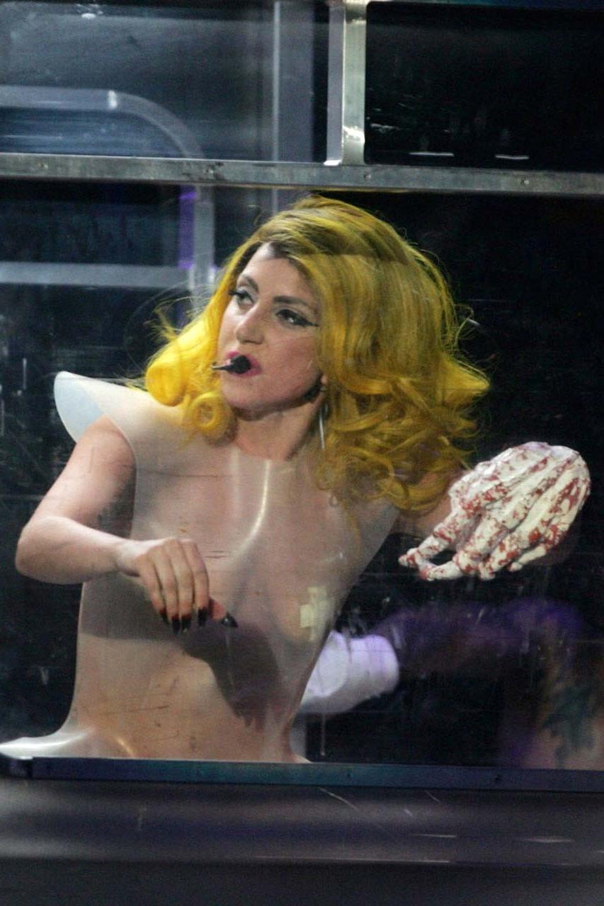 16P Lady Gaga exposing her tits in see thru dress on stage paparazzi pictures