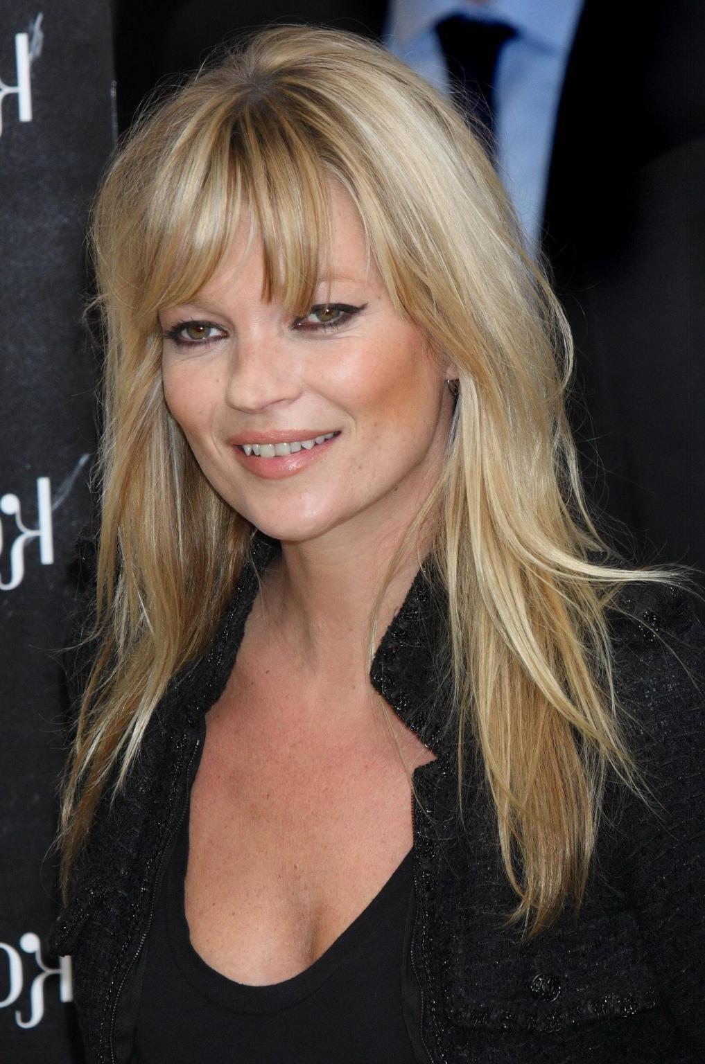 16P Kate Moss braless showing nice cleavage in black top at 'Vintage Muse' fragrance