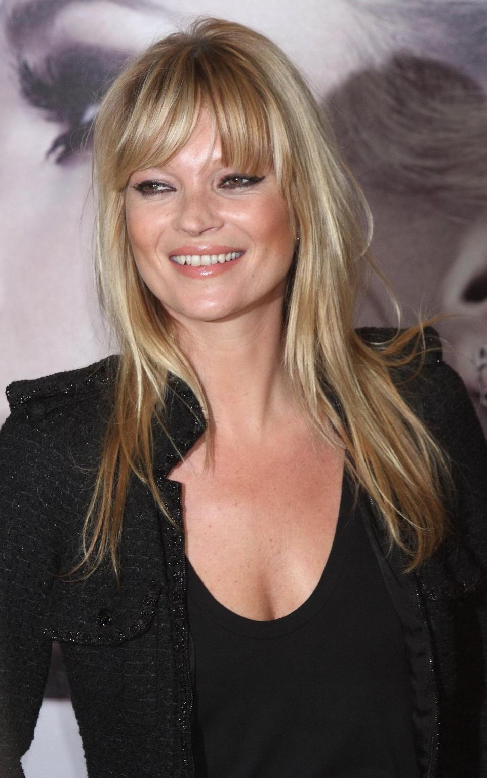 16P Kate Moss braless showing nice cleavage in black top at 'Vintage Muse' fragrance