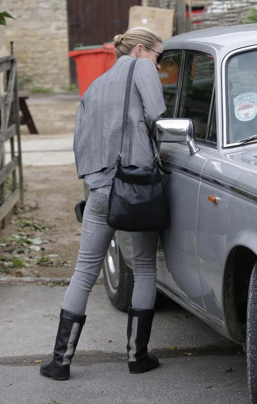 16P Kate Moss braless showing nice cleavage in black top at 'Vintage Muse' fragrance