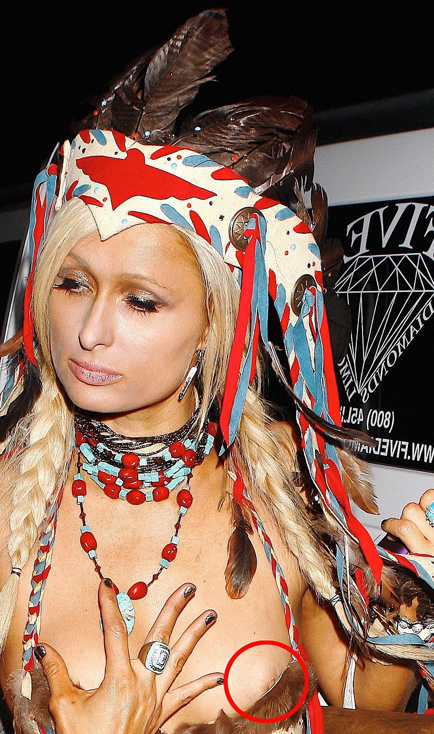 15P Paris Hilton nice cleavage and posing topless