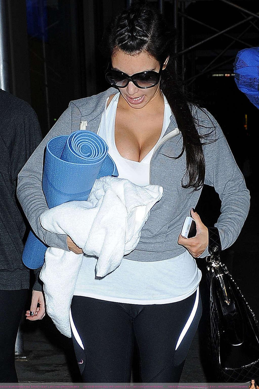 16P Kim Kardashian exposing sexy nude body and huge cleavage while going to yoga cla
