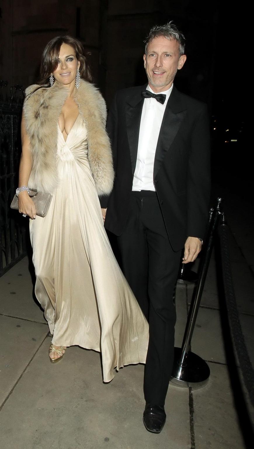 16P Elizabeth Hurley showing massive cleavage heading to Elton John's private party 