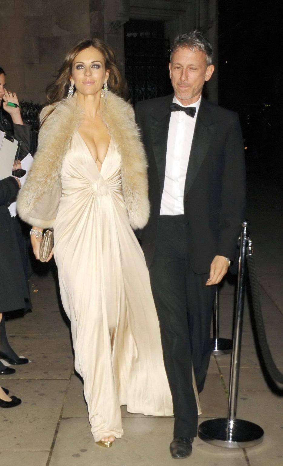 16P Elizabeth Hurley showing massive cleavage heading to Elton John's private party 