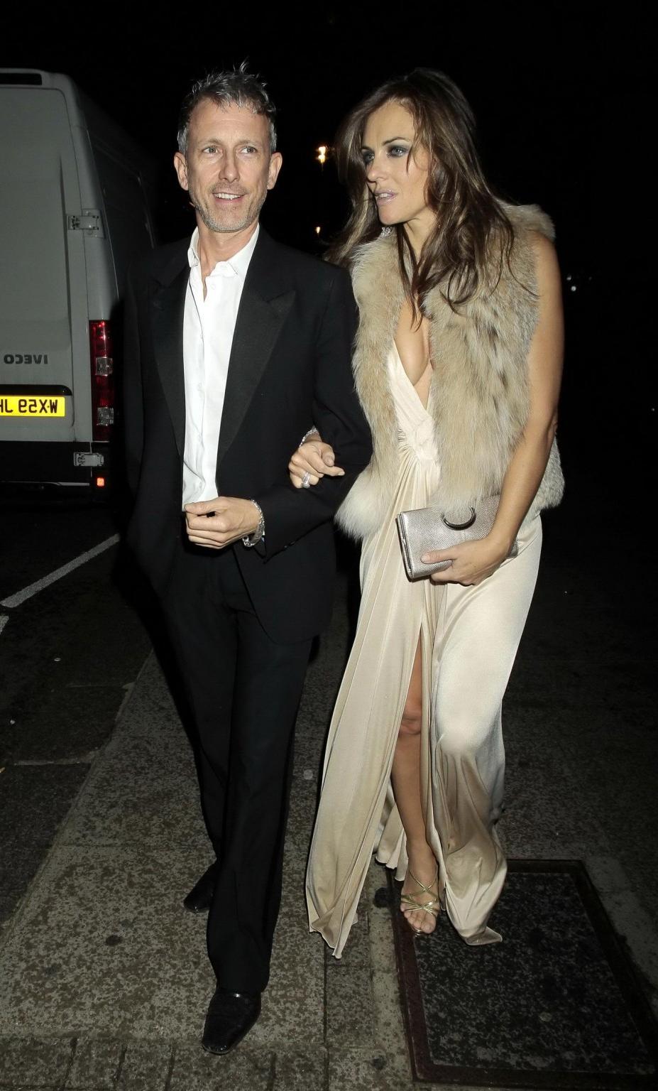 16P Elizabeth Hurley showing massive cleavage heading to Elton John's private party 