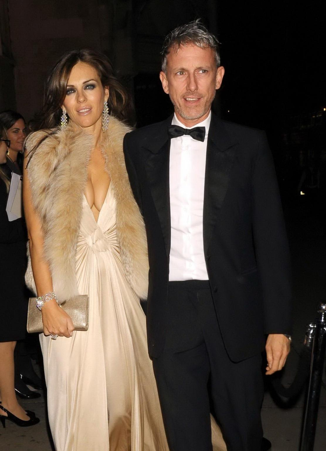 16P Elizabeth Hurley showing massive cleavage heading to Elton John's private party 
