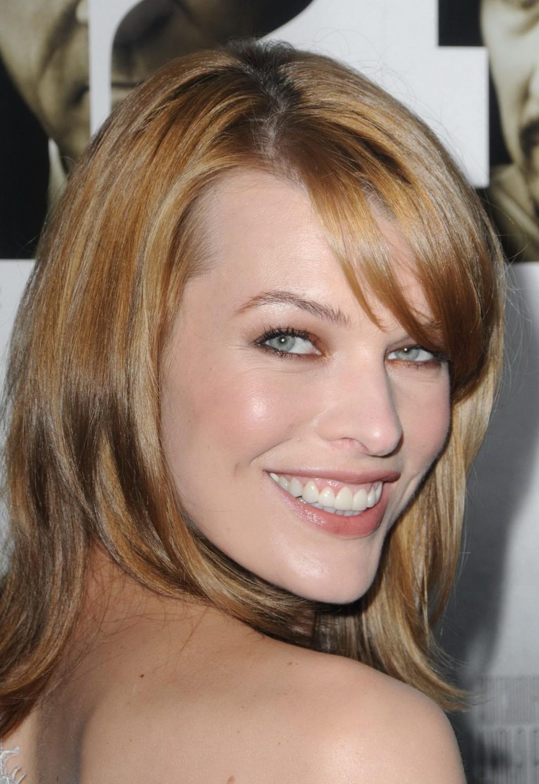 16P Milla Jovovich leggy wearing  tiny white lace dress at the 'Stone' premiere in N