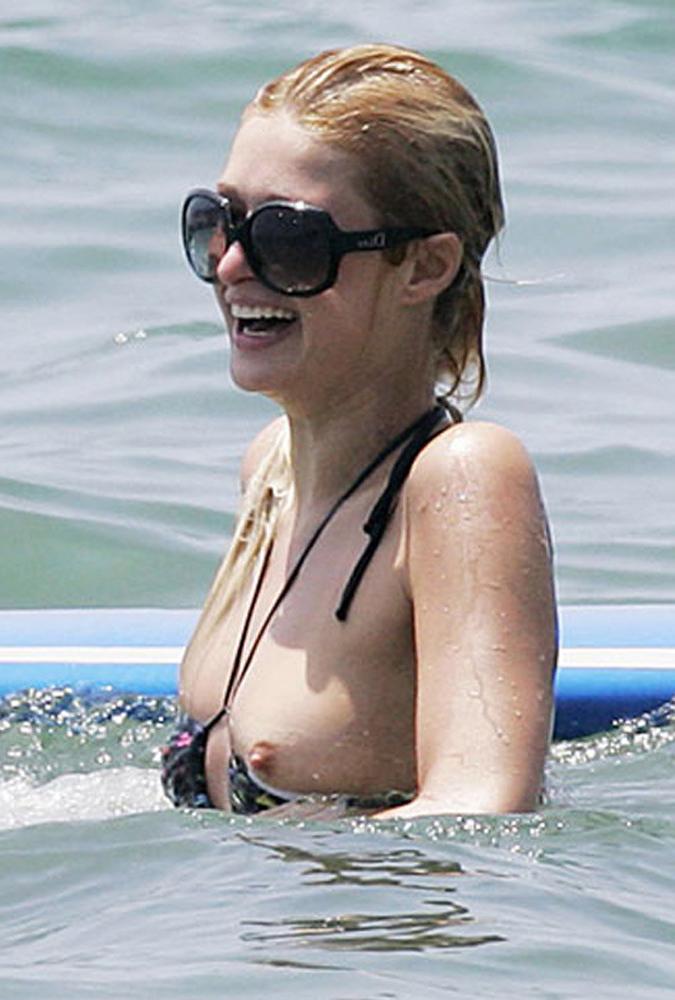 15P Paris Hilton nice nipple slip and sweet topless