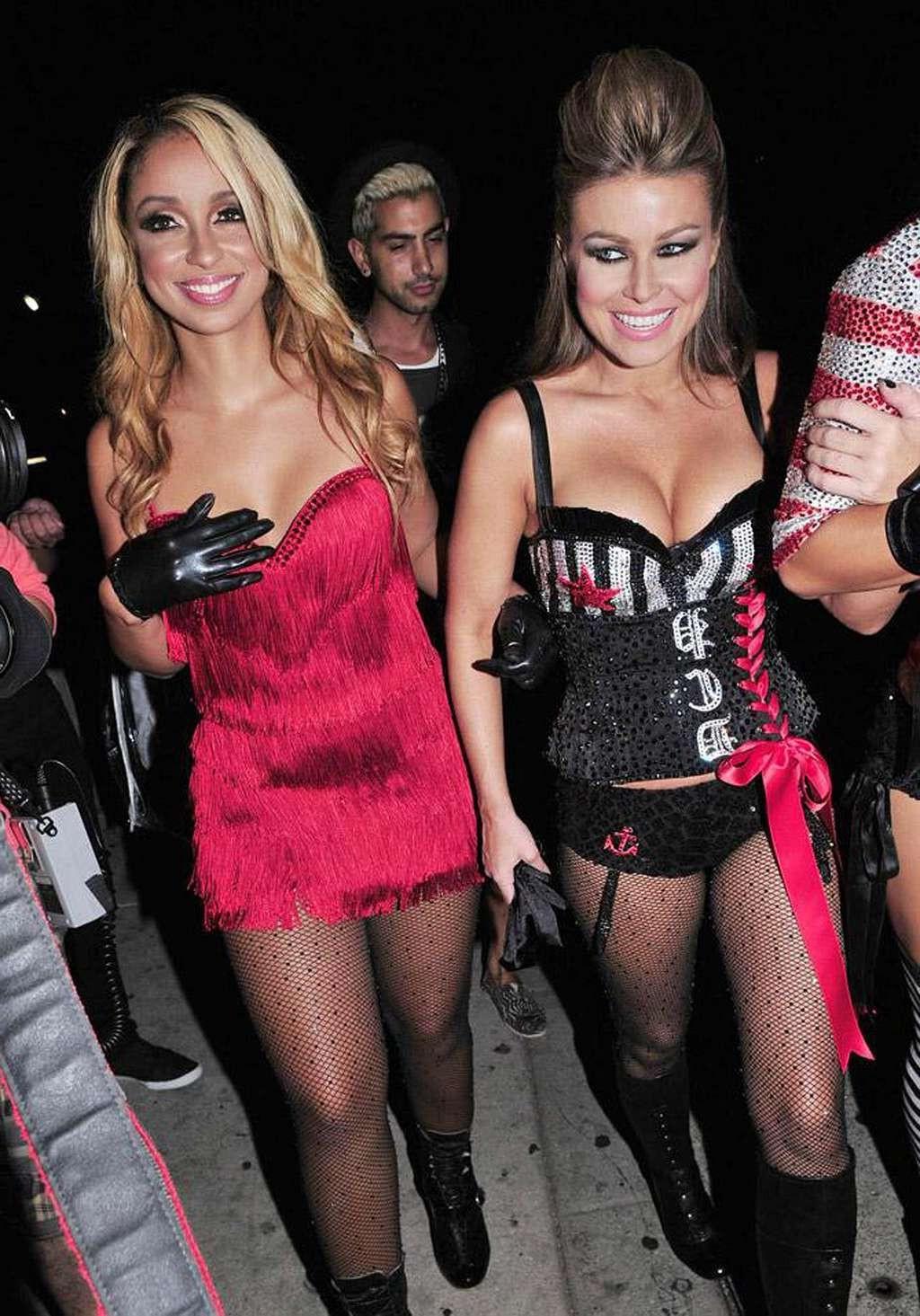 10P Carmen Electra looking sexy and hot in fishnet stockings in public and exposing 