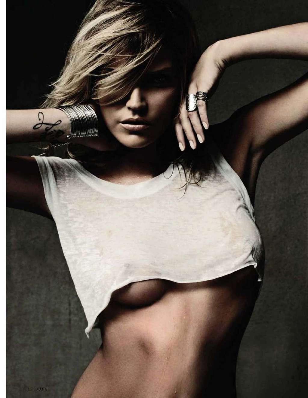 10P May Andersen tits slip from top and posing sexy in skimpy black bikini paparazzi