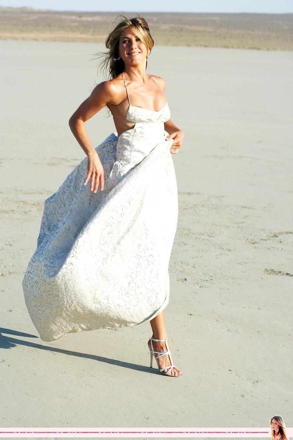 15P Jennifer Aniston almost nip slip at the 'Harper's Bazaar' beach photoshoot