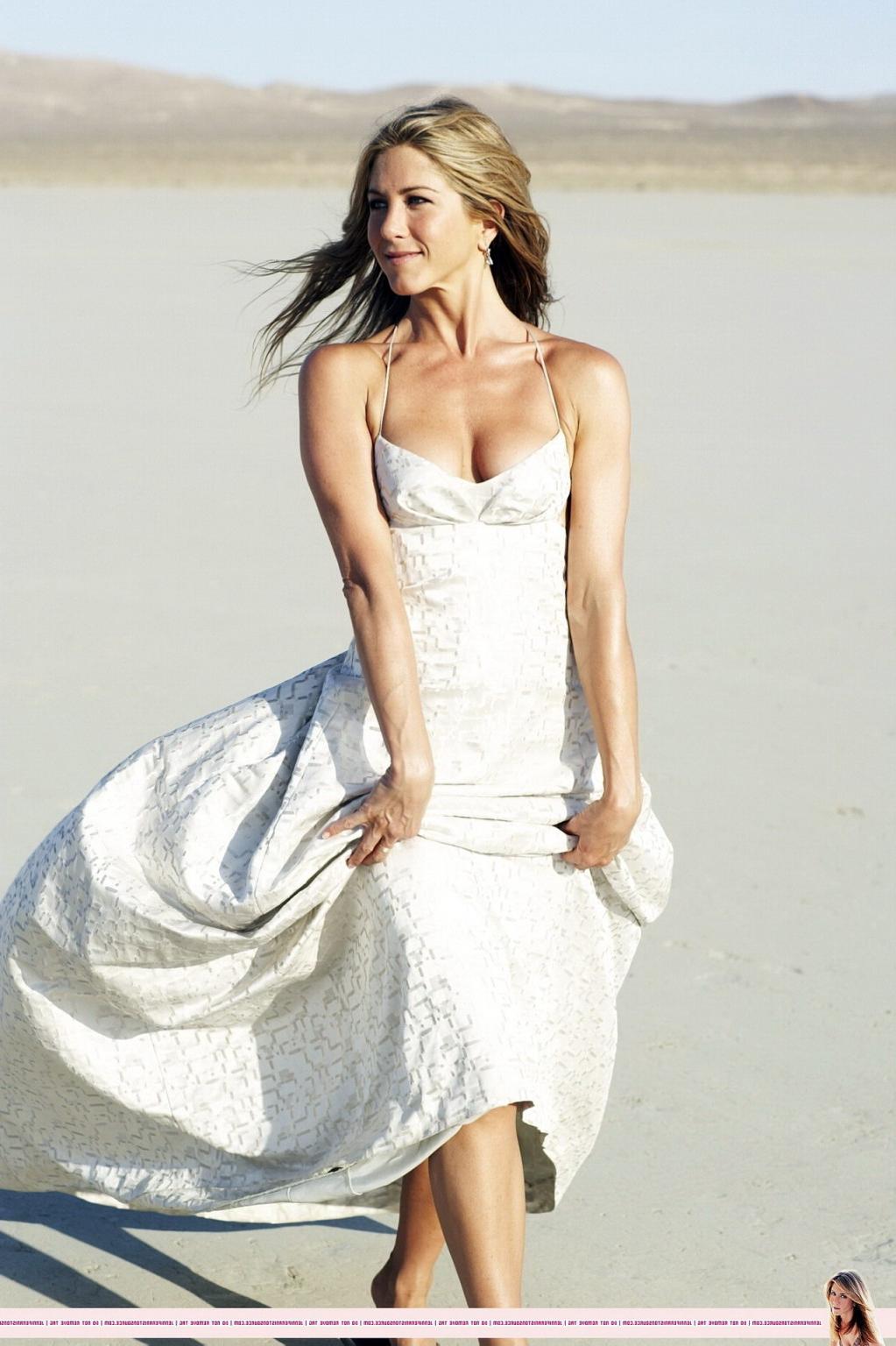 15P Jennifer Aniston almost nip slip at the 'Harper's Bazaar' beach photoshoot