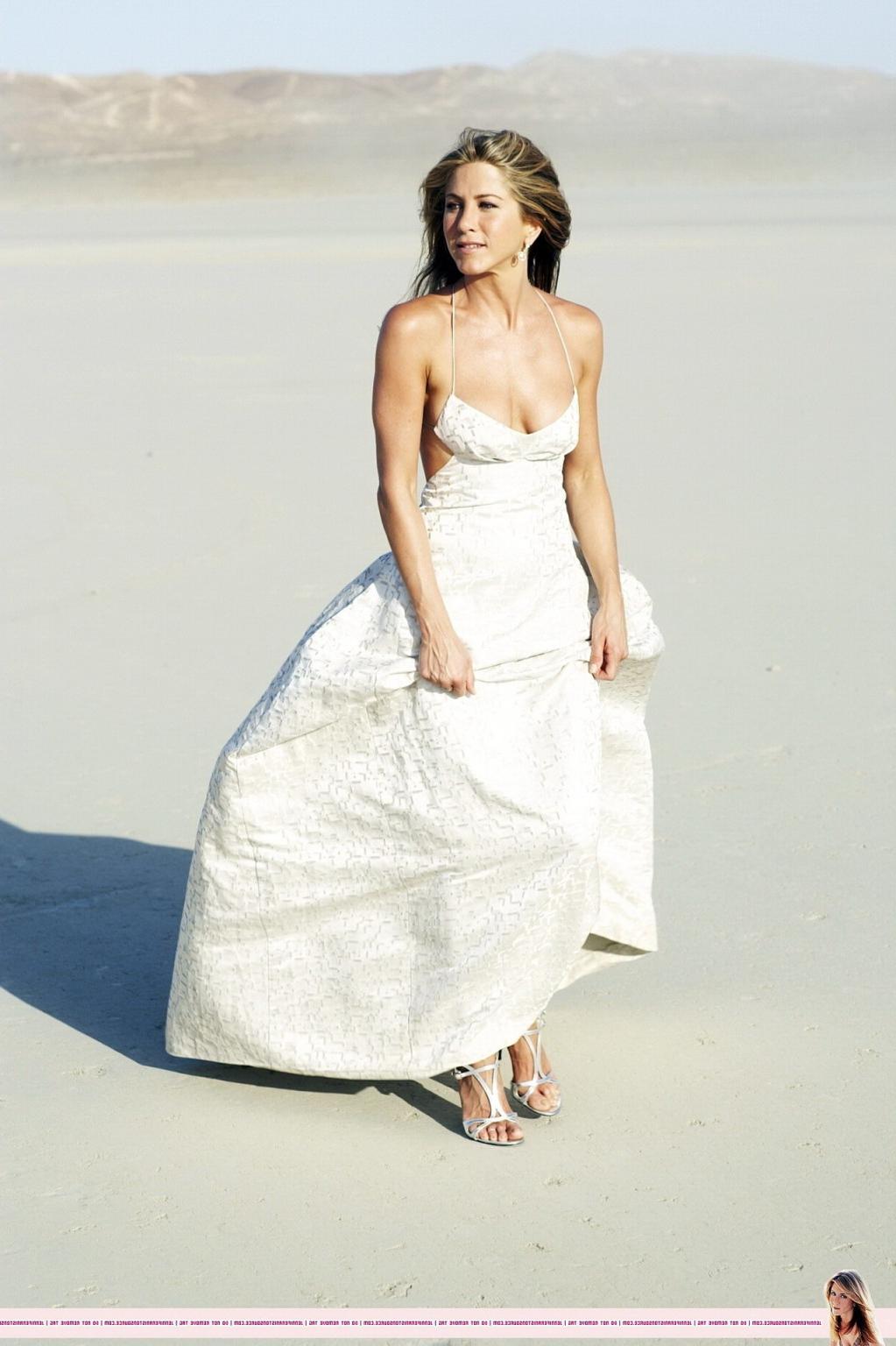 15P Jennifer Aniston almost nip slip at the 'Harper's Bazaar' beach photoshoot