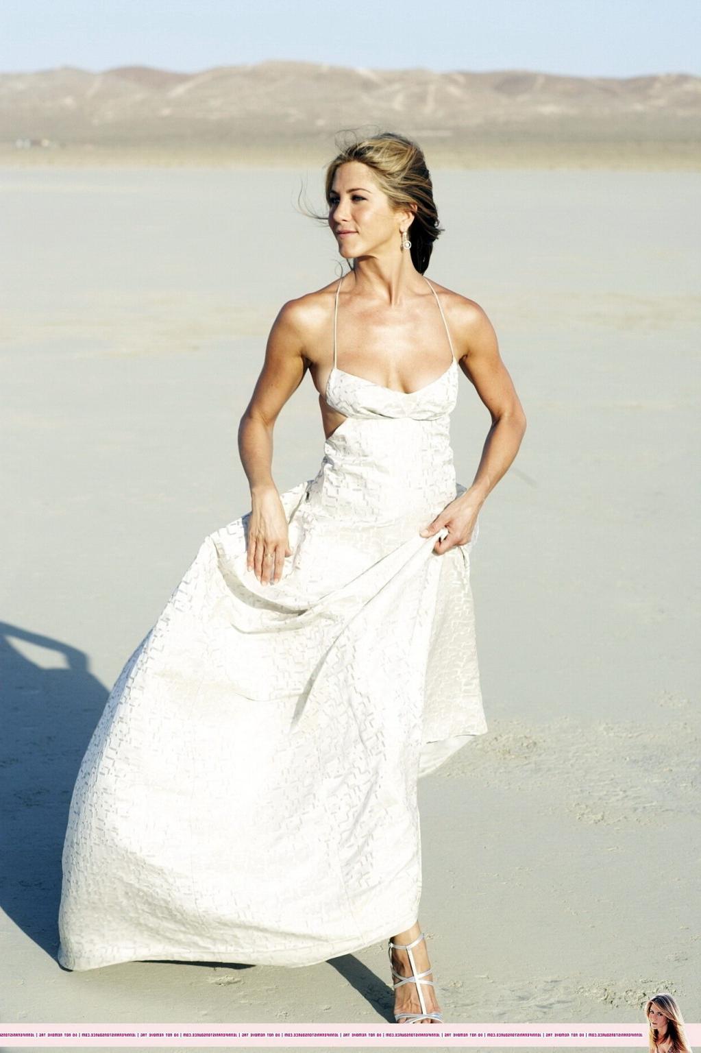 15P Jennifer Aniston almost nip slip at the 'Harper's Bazaar' beach photoshoot