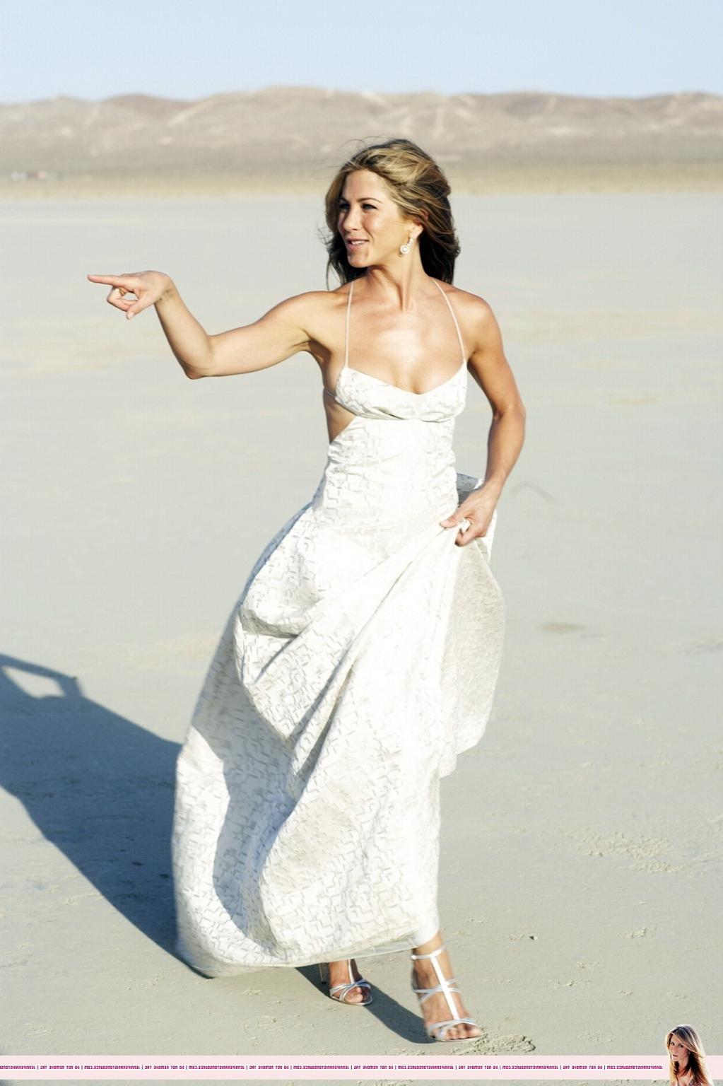 15P Jennifer Aniston almost nip slip at the 'Harper's Bazaar' beach photoshoot