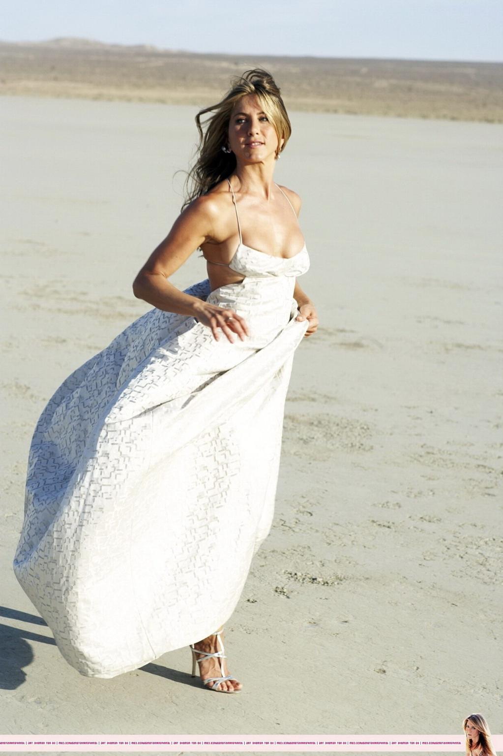 15P Jennifer Aniston almost nip slip at the 'Harper's Bazaar' beach photoshoot