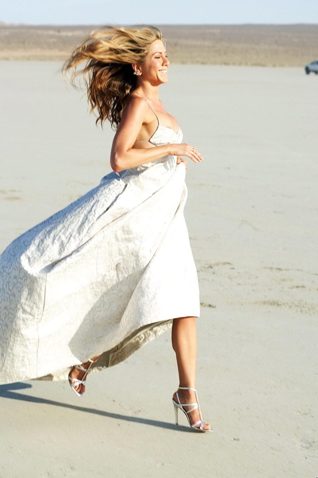 15P Jennifer Aniston almost nip slip at the 'Harper's Bazaar' beach photoshoot