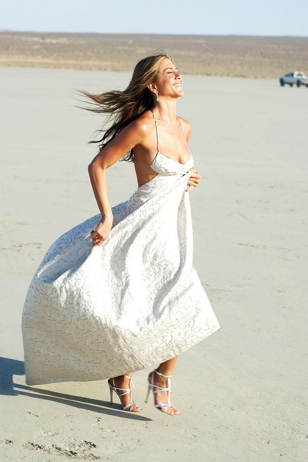 15P Jennifer Aniston almost nip slip at the 'Harper's Bazaar' beach photoshoot