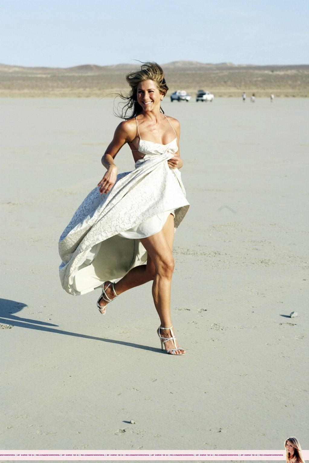 15P Jennifer Aniston almost nip slip at the 'Harper's Bazaar' beach photoshoot