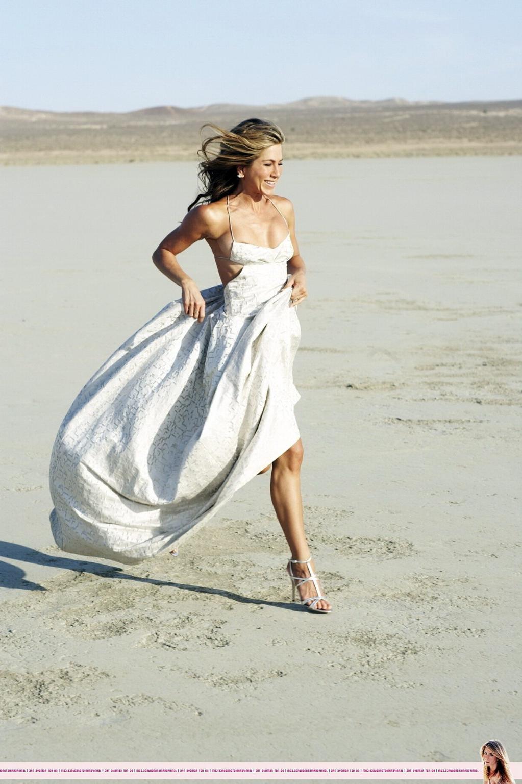 15P Jennifer Aniston almost nip slip at the 'Harper's Bazaar' beach photoshoot