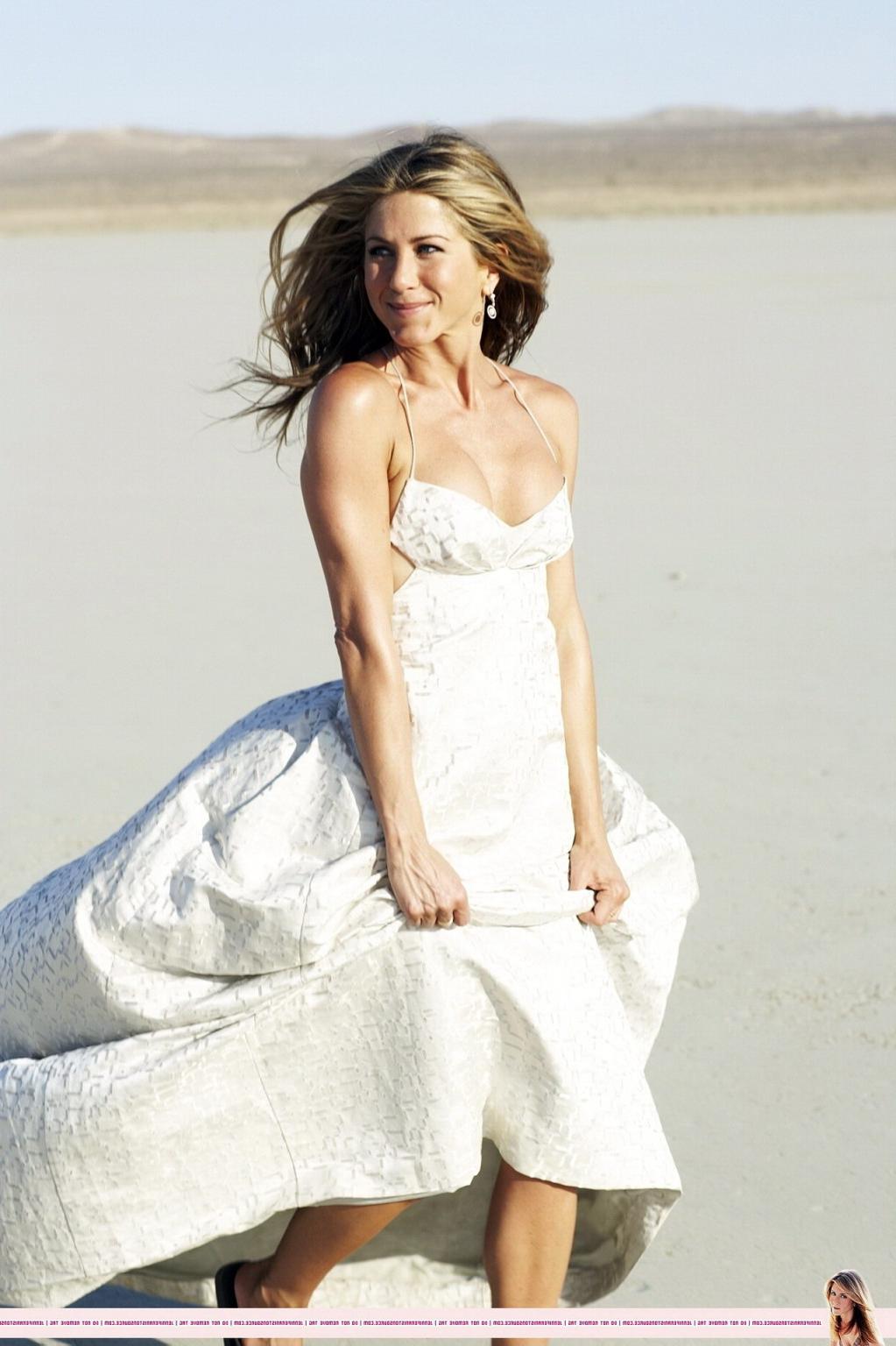 15P Jennifer Aniston almost nip slip at the 'Harper's Bazaar' beach photoshoot