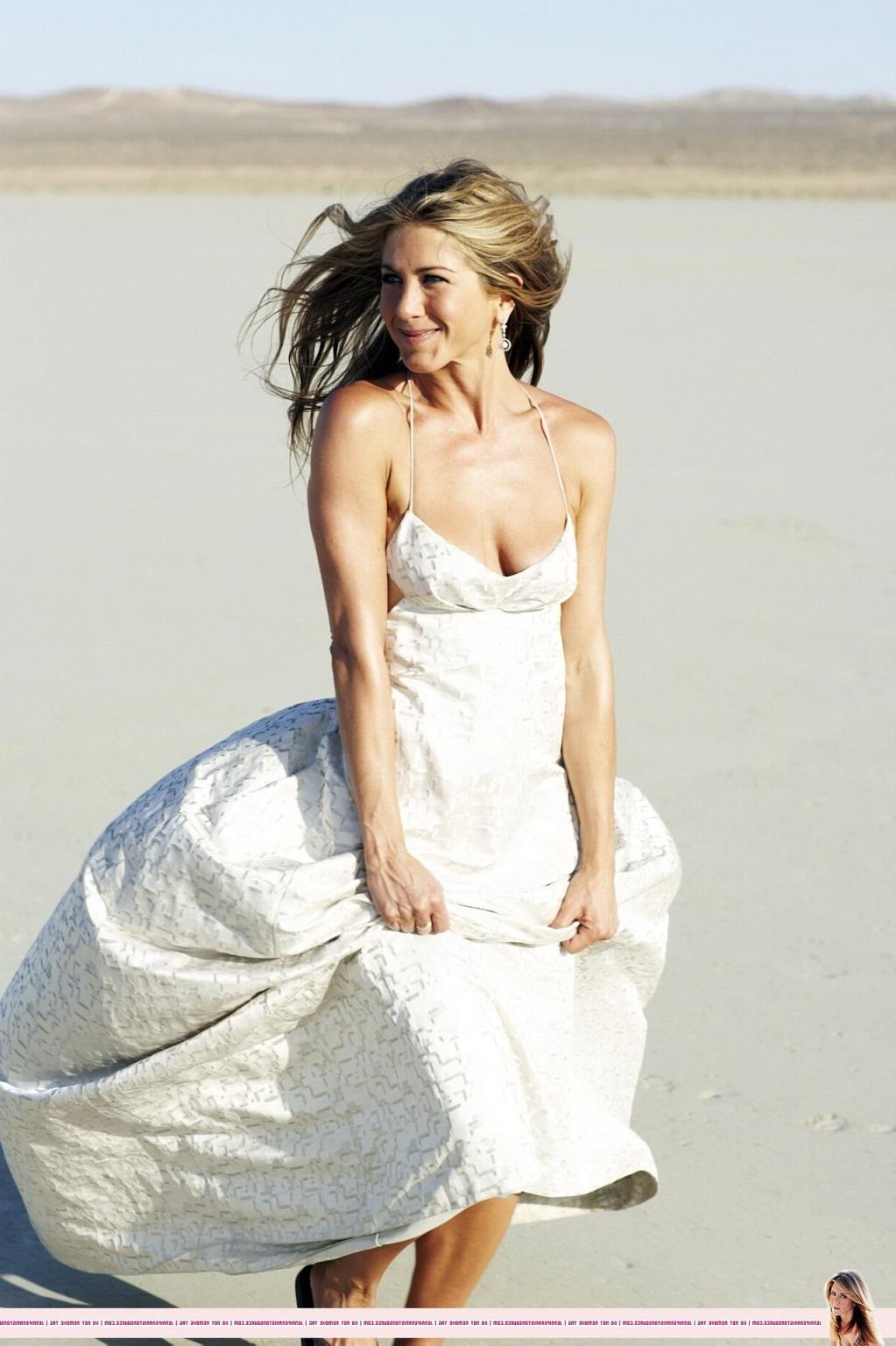 15P Jennifer Aniston almost nip slip at the 'Harper's Bazaar' beach photoshoot