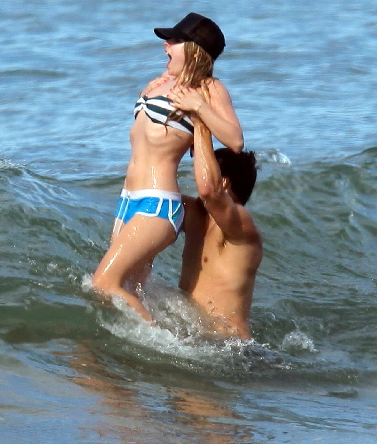 15P Avril Lavigne bikini nip slip at the beach in Malibu