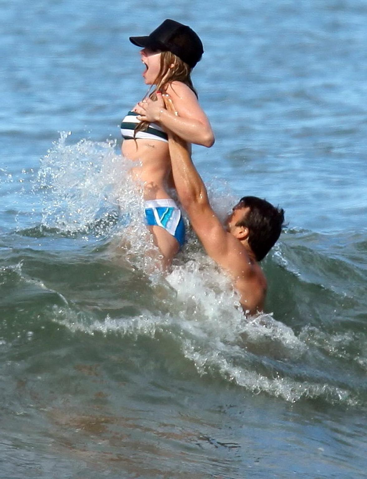 15P Avril Lavigne bikini nip slip at the beach in Malibu