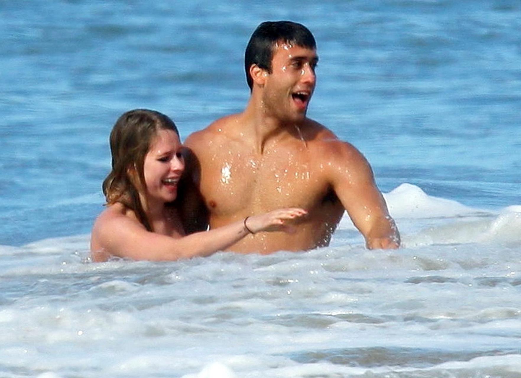 15P Avril Lavigne bikini nip slip at the beach in Malibu