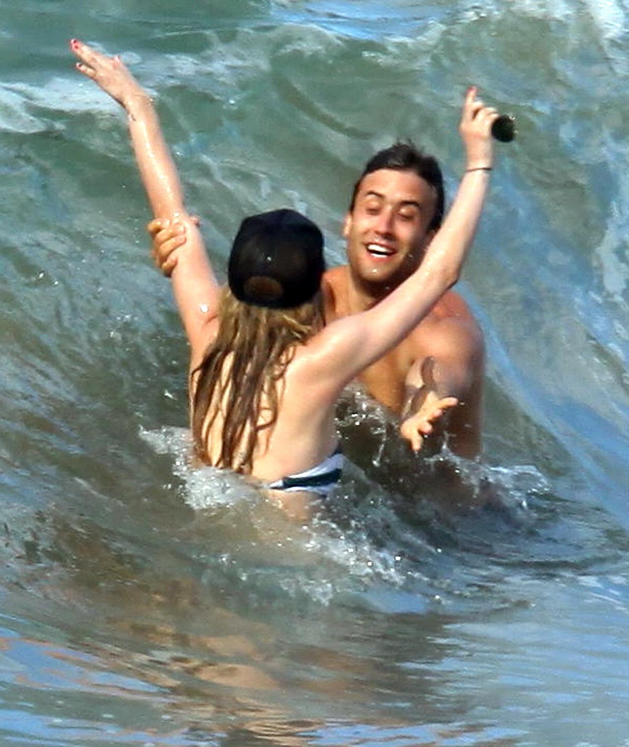 15P Avril Lavigne bikini nip slip at the beach in Malibu