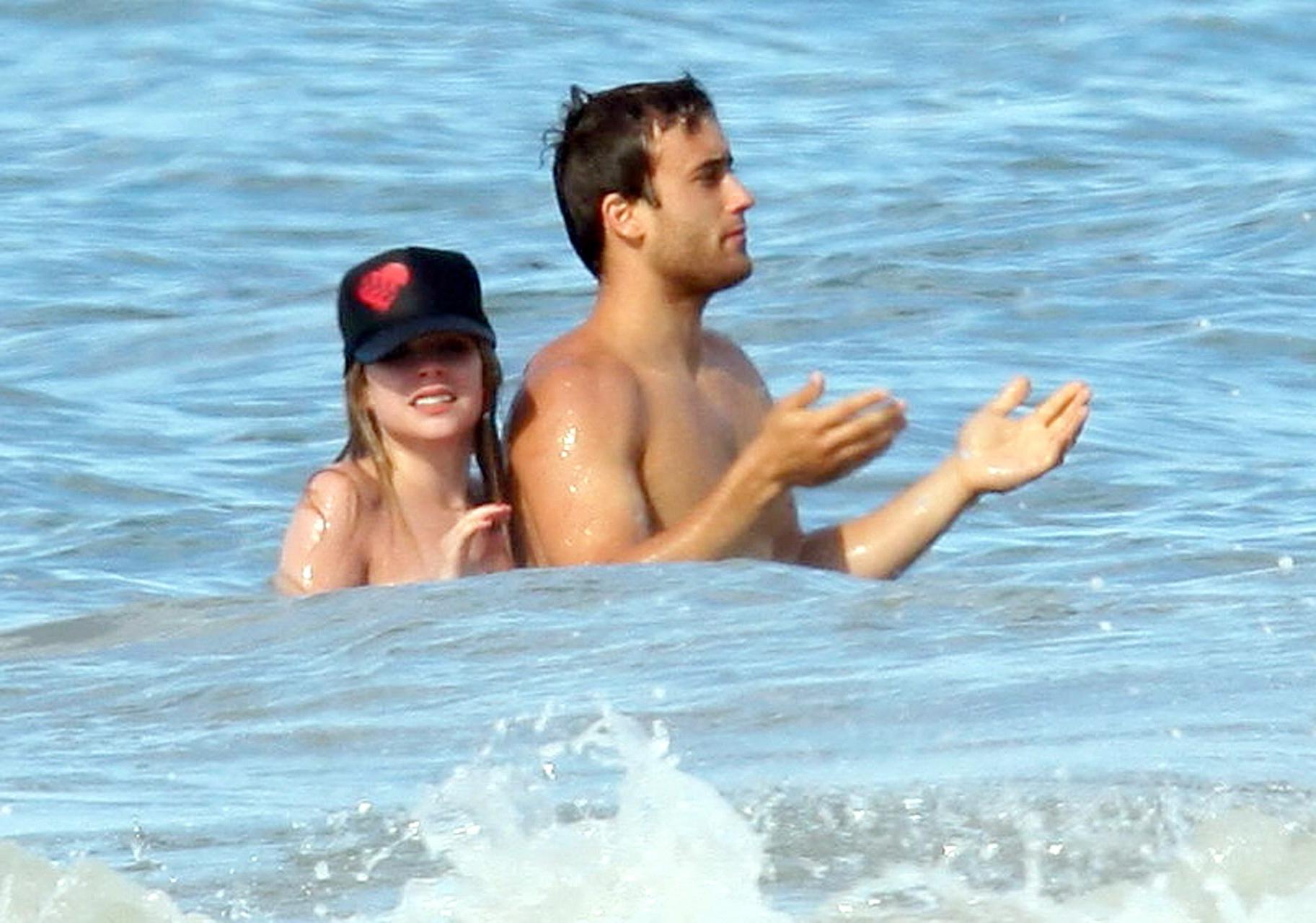 15P Avril Lavigne bikini nip slip at the beach in Malibu
