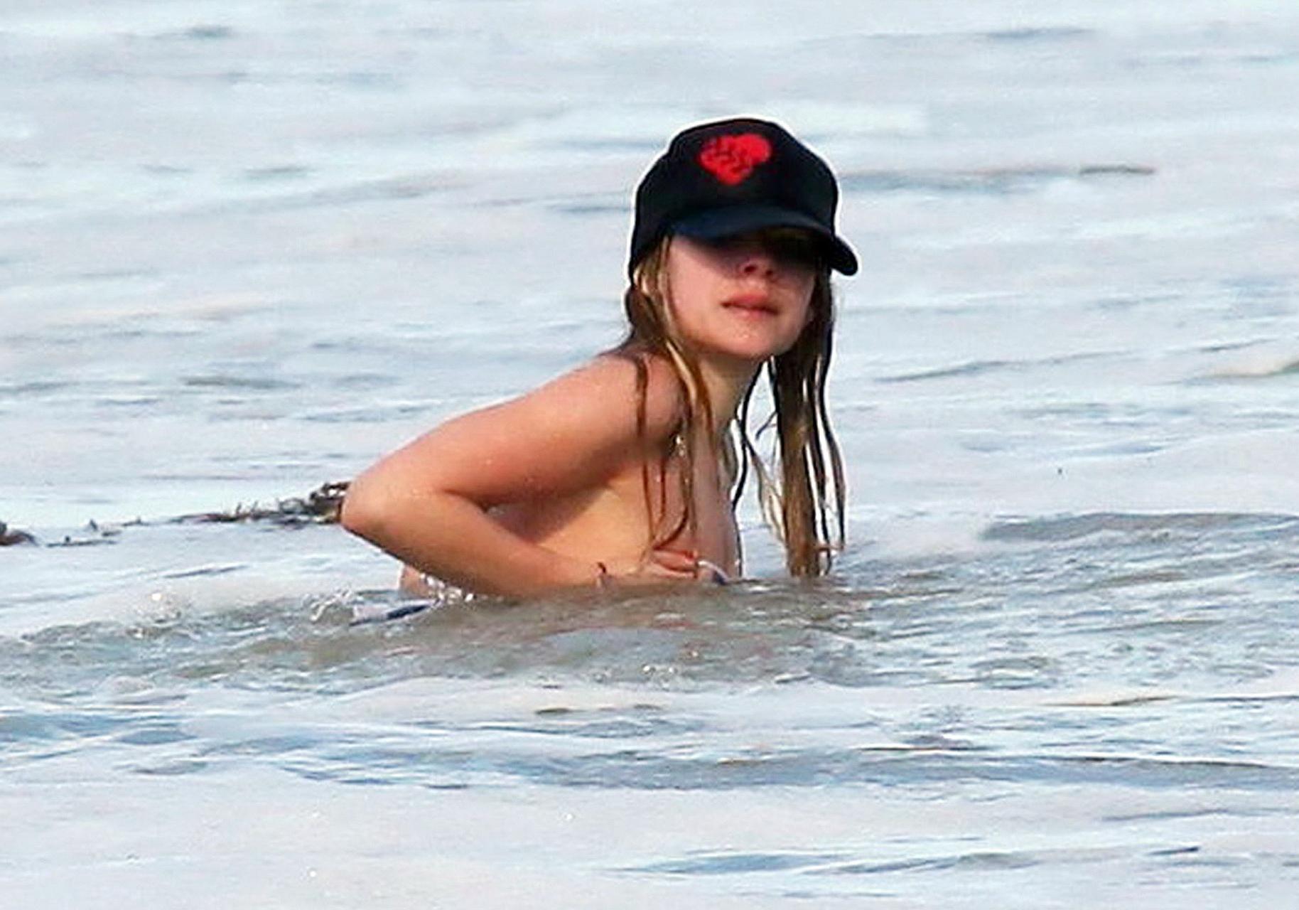 15P Avril Lavigne bikini nip slip at the beach in Malibu