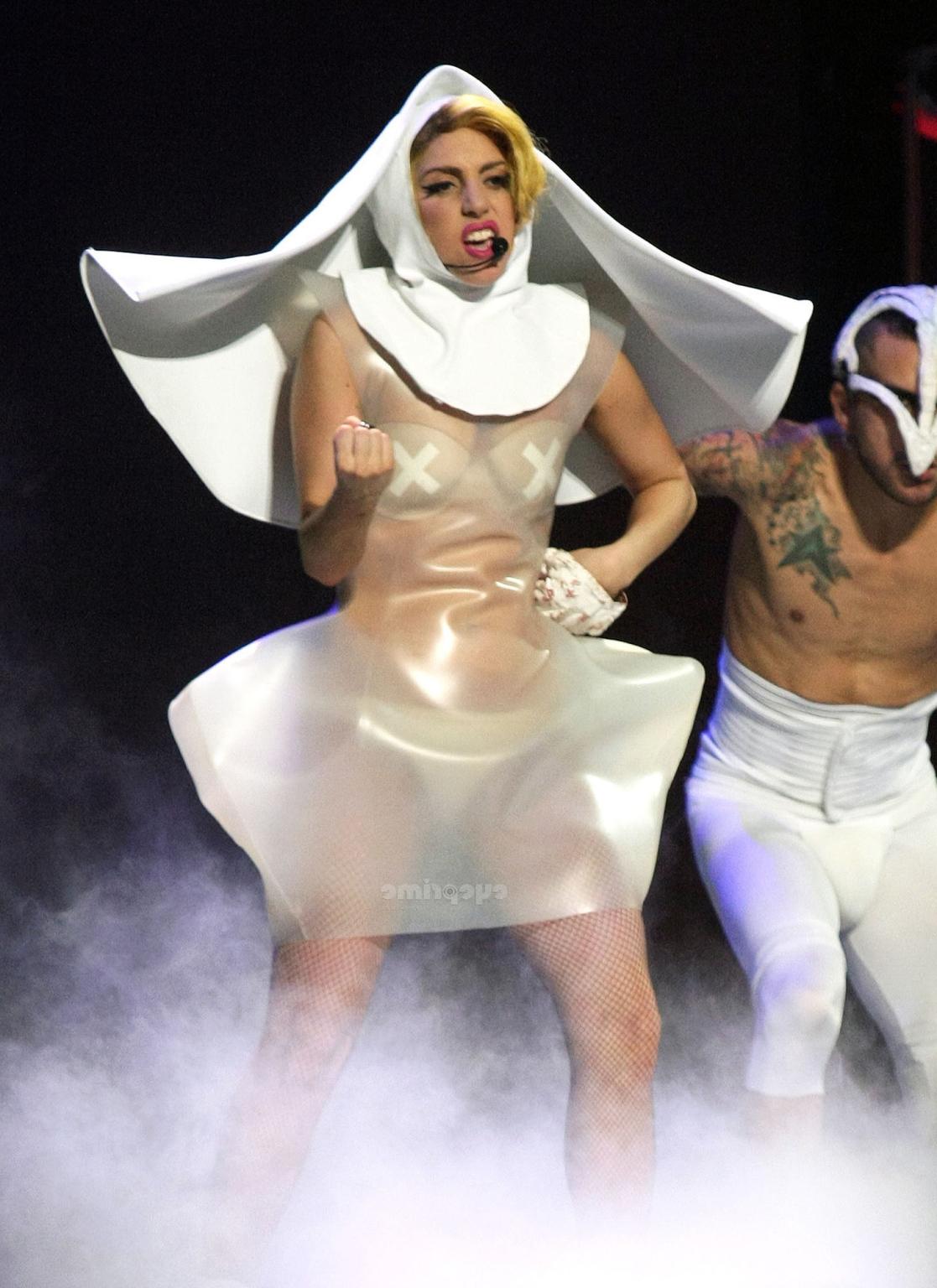 16P Lady Gaga as Vampirella in lingerie showing bloody cleavage on stage