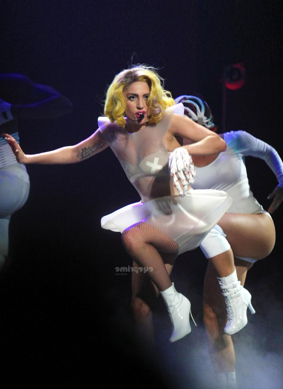 16P Lady Gaga as Vampirella in lingerie showing bloody cleavage on stage