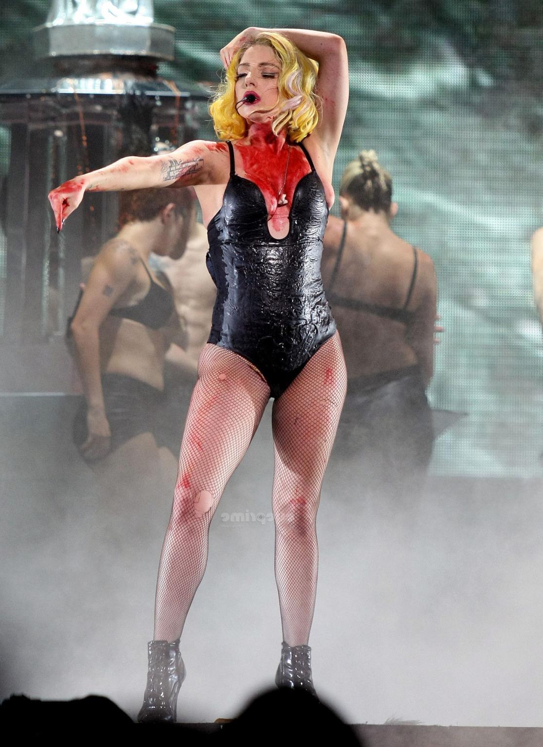 16P Lady Gaga as Vampirella in lingerie showing bloody cleavage on stage