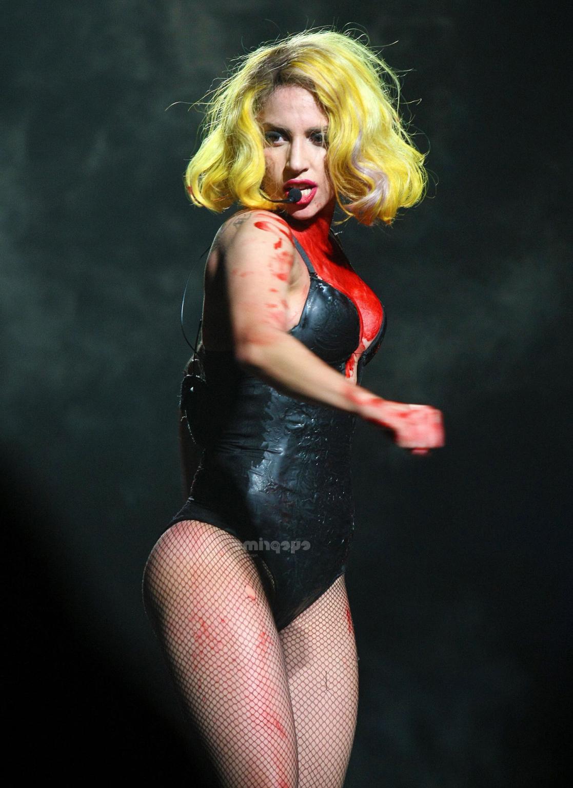 16P Lady Gaga as Vampirella in lingerie showing bloody cleavage on stage