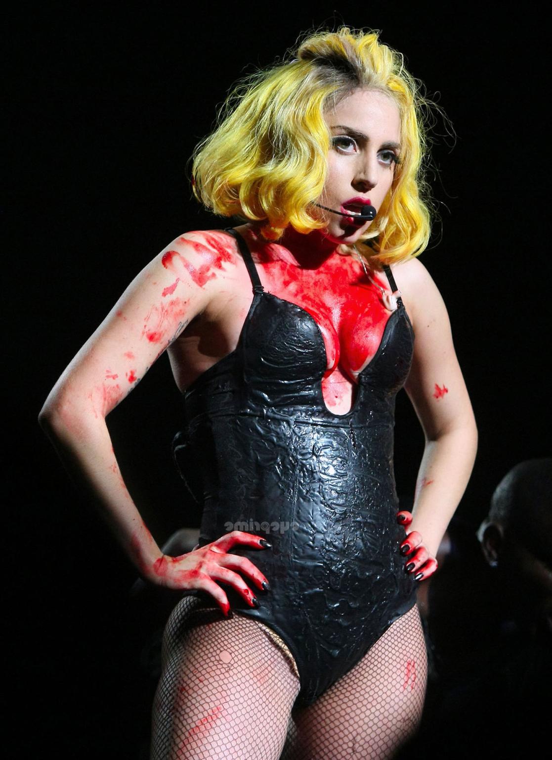 16P Lady Gaga as Vampirella in lingerie showing bloody cleavage on stage