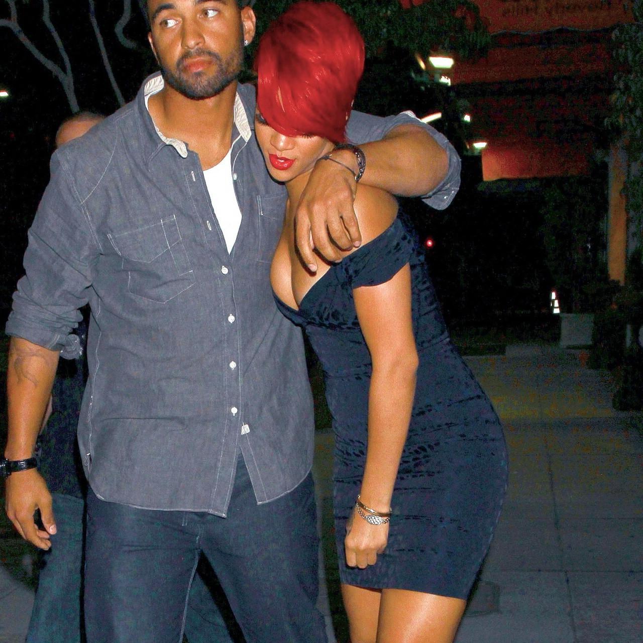 15P Rihanna shows huge cleavage wearing mini dress out in Hollywood