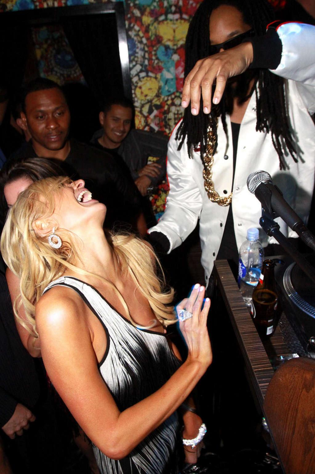 10P Paris Hilton nipple slip oops situation while parting and flashing her nice puss