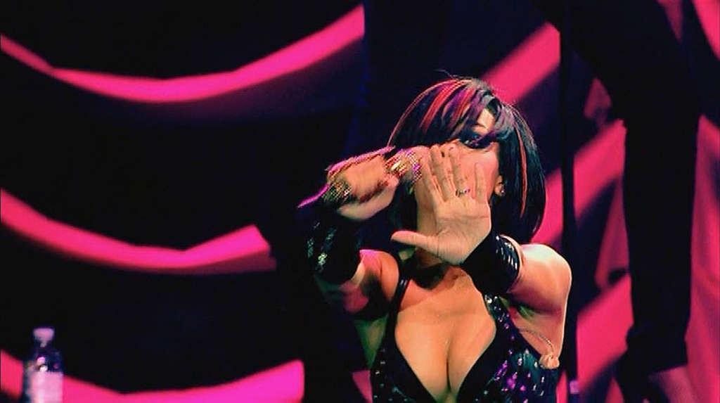 16P Rihanna show big cleavage and very leggy on stage
