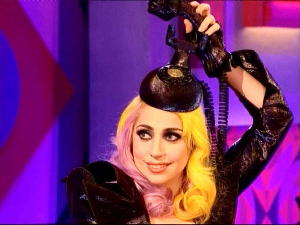 16P Lady Gaga in ripped fishnets stockings on stage and with long hair