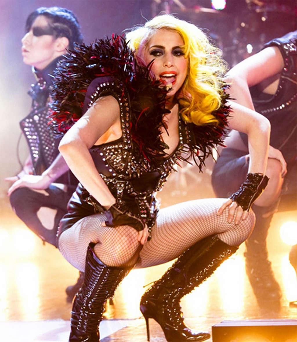 16P Lady Gaga in ripped fishnets stockings on stage and with long hair